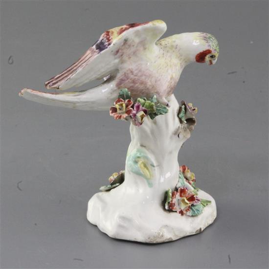 An early Derby figure of a goldfinch, c.1756, h. 12.3cm, lacking right leg and branch